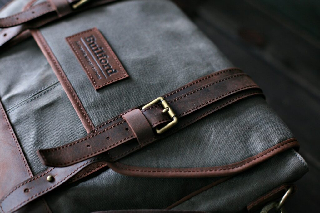 A stylish man walking with a Builford Bohemian bag, demonstrating its versatility for office and travel.